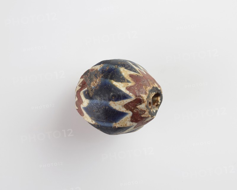 Bead, egg-shaped, with chamfered sides. Two sides chipped away, 13th-14th centuries. Creator: Unknown.