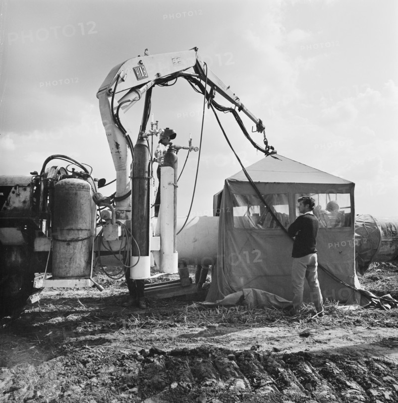 A view of welding taking place along the Fens gas pipeline, Norfolk, 10/08/1967. Creator: John Laing plc.