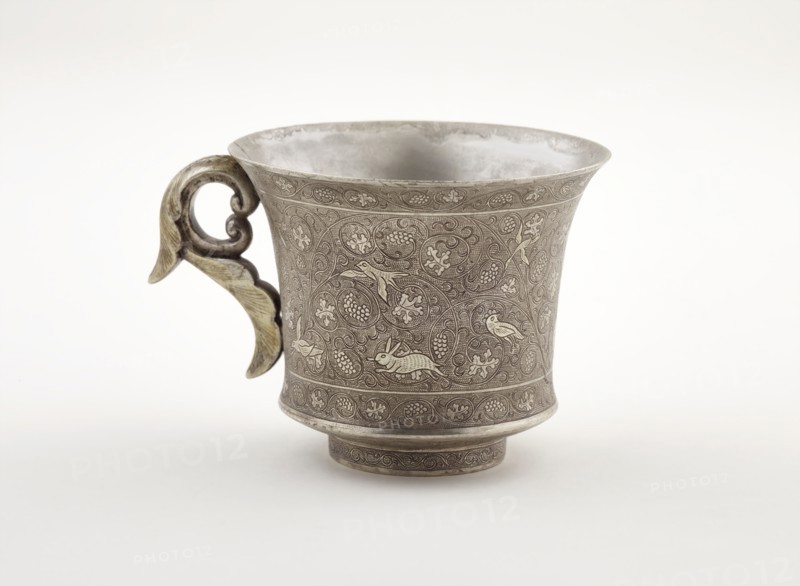 Wine cup with ring handle, birds, animals, and grape vines, Early Tang dynasty, late 7th century. Creator: Unknown.