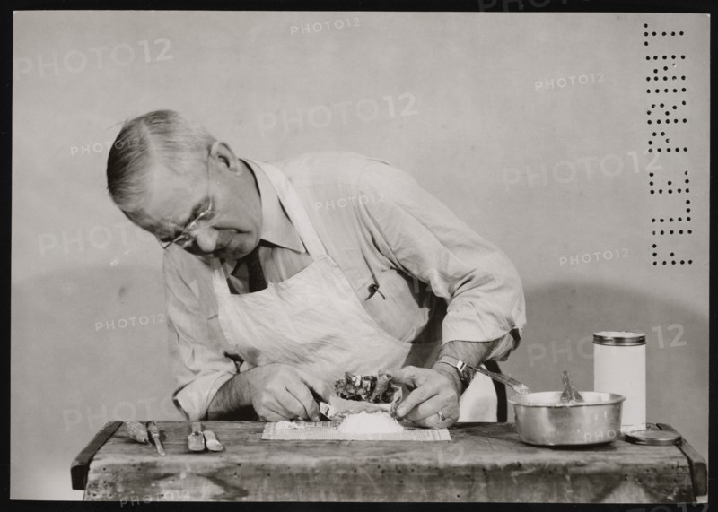 Frank Earl Holden Demonstrates Cutting into Mineral, January 18, 1951. Creator: United States National Museum Photographic Laboratory.
