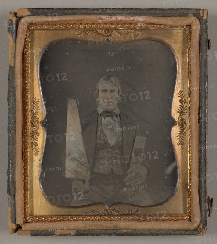 Untitled [portrait of a man holding carpentry tools], 1839/99.  Creator: Unknown.