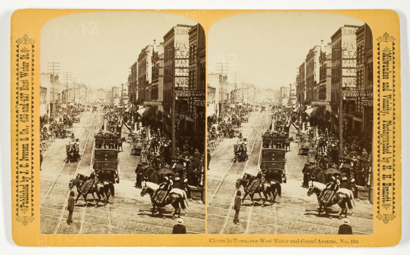 Circus in Town, cor West Water and Grand Avenue, 1880/89. Creator: Henry Hamilton Bennett.
