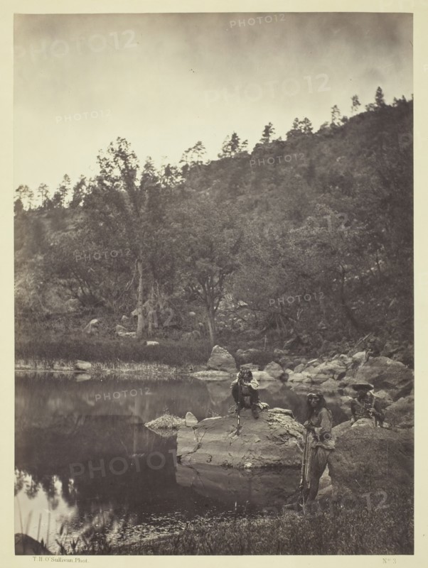View on Apache Lake, Sierra Blanca Range, Arizona, Two Apache Scouts in the Foreground, 1873. Creator: Tim O'Sullivan.