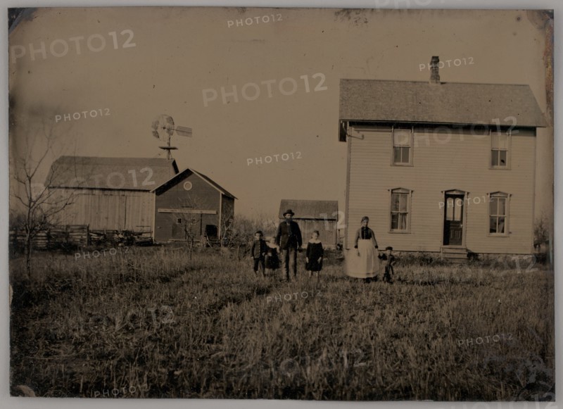 Untitled (A Man, a Woman, and Three Children Standing in Front of a Farmhouse), 1875. Creator: Unknown.