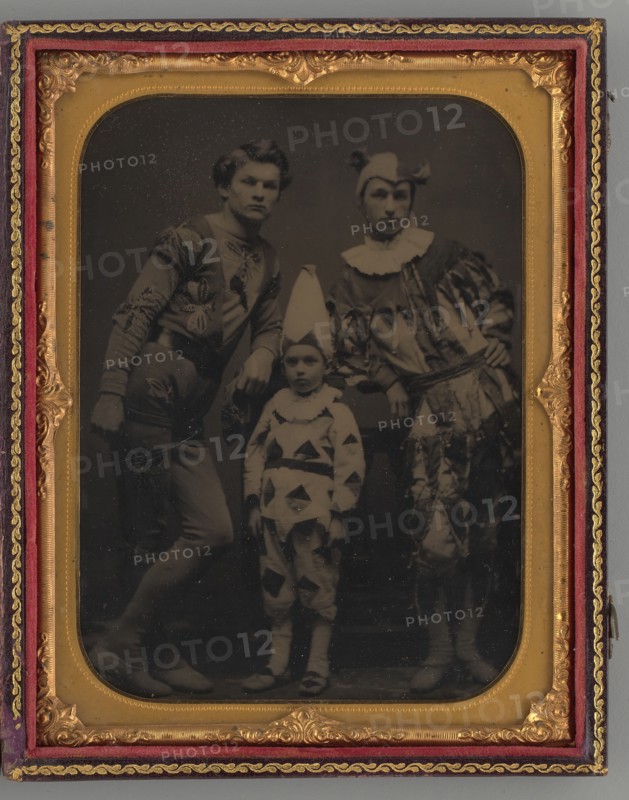 Untitled (Portrait of two Men and one Boy, Dressed in Clown Costumes), 1865. Creator: Unknown.