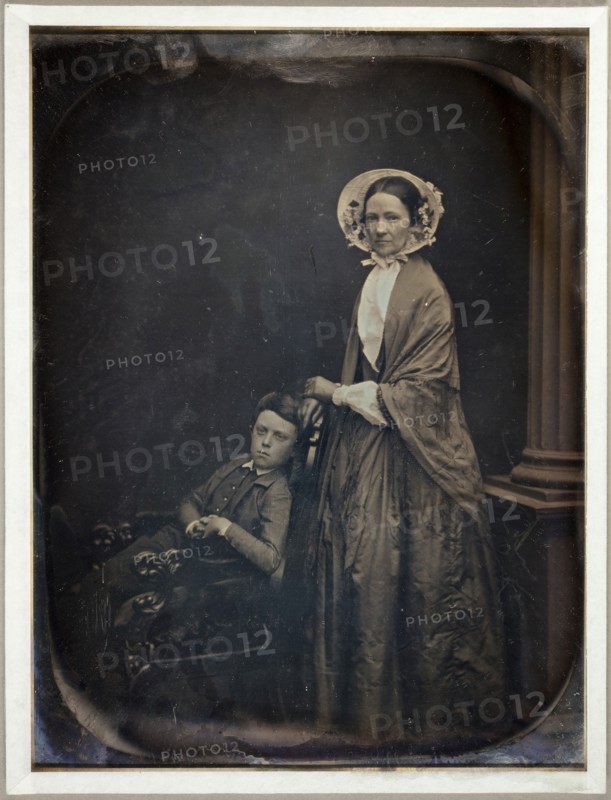 Untitled (A Woman in Bonnet and Shawl, with her Seated Son), c. 1850. Creators: Albert Sands Southworth, Josiah Johnson Hawes.