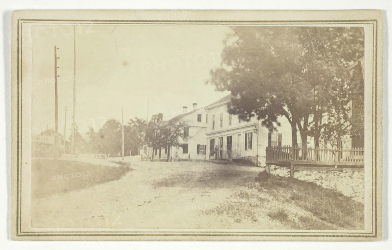 Untitled (view of road with white clapboard houses), mid-late 19th century.  Creator: T. Holmes.