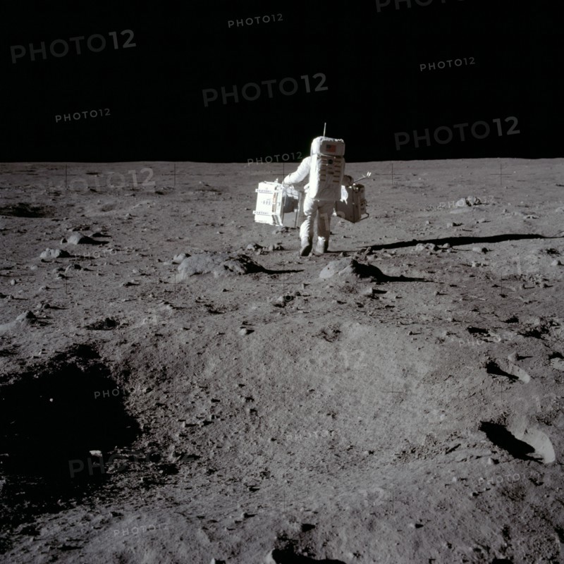 Buzz Aldrin carries out an experiment on the lunar surface, Apollo II mission, July 1969.  Creator: Neil Armstrong.