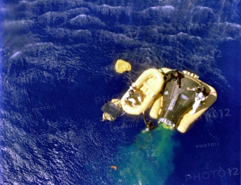 Cooper and Conrad await recovery relicopter, 1965.  Creator: NASA.