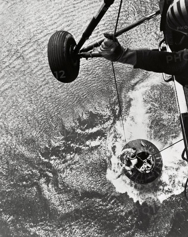 Shepard hoisted from Mercury capsule, 1961.  Creator: NASA.