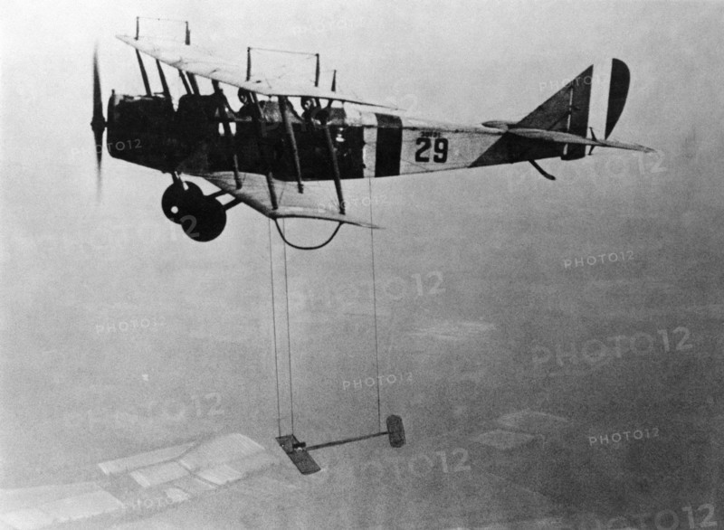 Curtiss JN-4 "Jenny" aircraft with model wing suspended, June 22, 1921. Creator: Unknown.