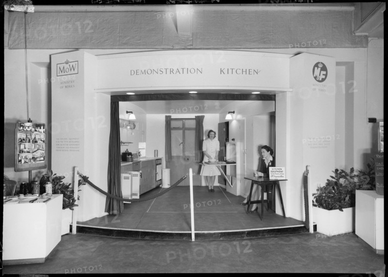 Two women in a demonstration kitchen, 1946. Creator: Ministry of Works.