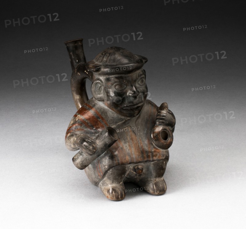 Handle Spout Vessel in the Form of a Figure Holding Corn Popper and Rolled Mat, 100 B.C./A.D. 500. Creator: Unknown.