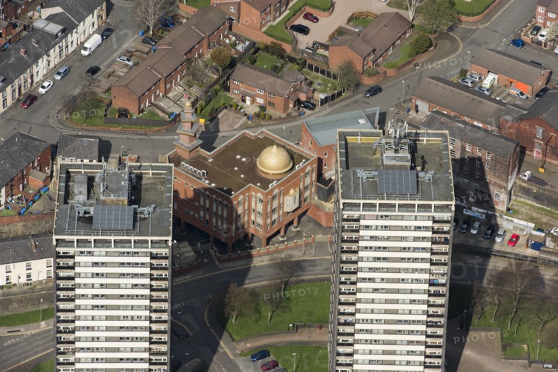 Golden Mosque overshadowed by two of the Seven Sisters towers, Rochdale, 2019. Creator: Historic England.