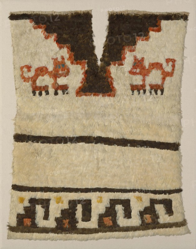 Tunic Fragment, Peru, A.D. 1470/1532. Cat motif. Embellished with feathers.