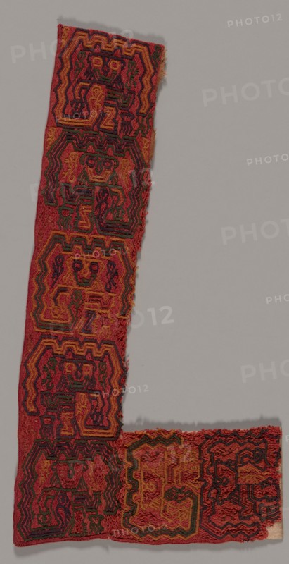 Border Fragment, Peru, 100 B.C./A.D. 200. Stylized figure with wide eyes and an upturned mouth, with streamers or appendages trailing from its body.