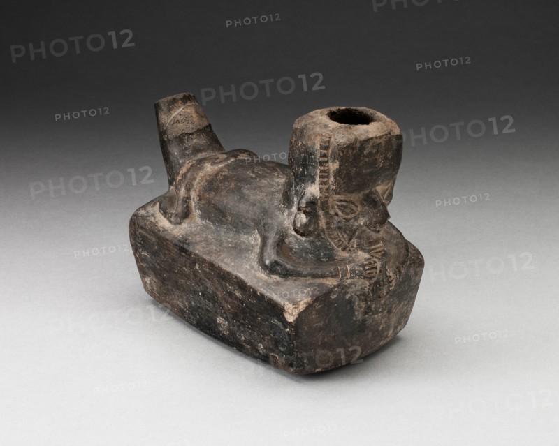 Vessel in the Form of a Flute-Player Laying atop Rectangle Shape, A.D. 1000/1400.