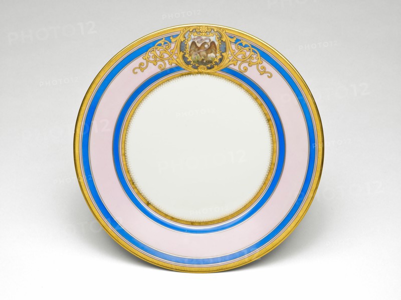 Illinois Plate, c. 1878/89. Porcelain plate painted with gold, filigree-patterned cartouche, bald eagle with the Illinois state motto, 'State Sovereignty, National Union'. Decorated by Joseph S. Potter.