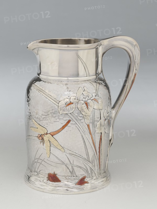 Pitcher, 1878. Silver, gold, and copper, hammered design featuring irises, fish and dragonfly, attributed to Edward C. Moore. Almost certainly inspired by the work of Katsushika Hokusai.