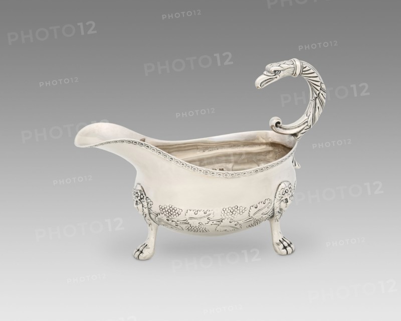 Sauce Boat, c. 1817/33. Bunches of grapes and vineleaves decoration, with handle in the shape of a bird of prey.