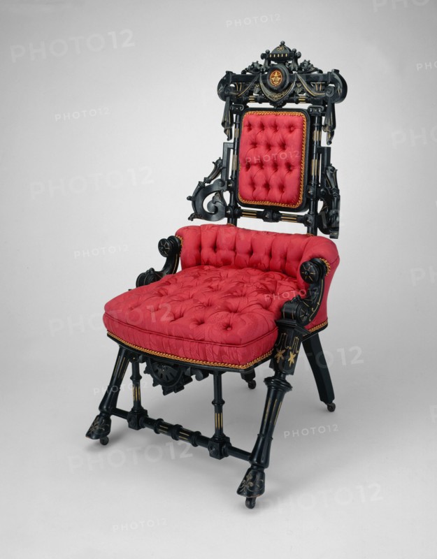Armchair, patented in 1869. Upholstered chair, ebonized walnut with gilt decoration.