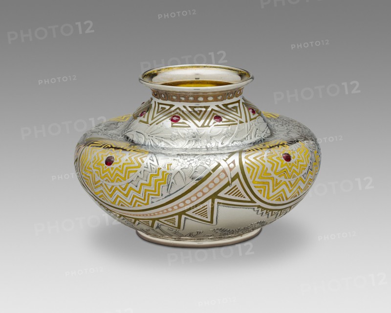 Pueblo Vase, 1893. Influenced by Native American Pueblo culture, silver inlaid with enamel, set with twelve faceted rubies. Designed by George Paulding Farnham.