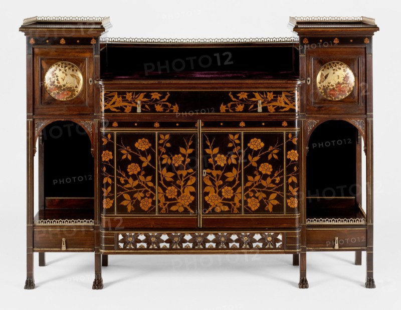 Cabinet, 1878/80. Wood cabinet with lighter wood floral design and brass.