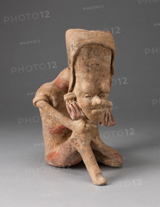 Seated Figure with an Elongated Head and Chin Placed on Knee, 300 B.C./A.D. 300.