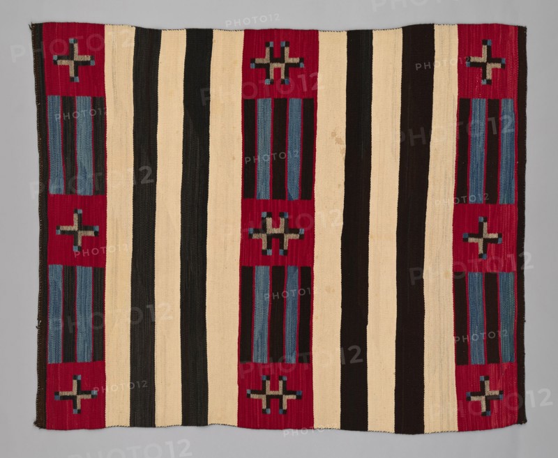 Chief Blanket (Third Phase), c. 1880. A work made of wool, single interlocking and slit tapestry weaves with "lazy lines"; twined warp ends and selvages.