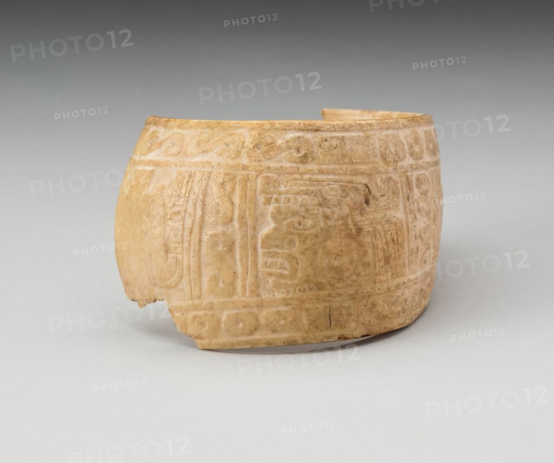 Shell, Possibly an Arm Band, Incised with Profile Head Framed by Geometric Motifs (Fragment), c. A.D. 1200.