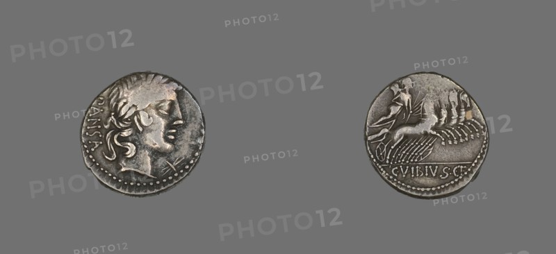 Denarius (Coin) Depicting the God Apollo, 90 BCE. Silver coin with a face in profile on one side, a figure riding a chariot pulled by four horses on the reverse.