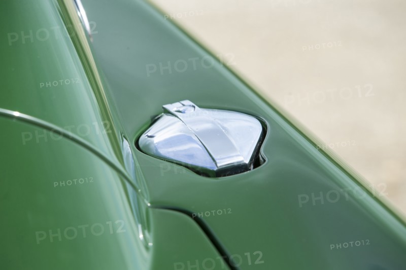 Petrol filler cap of a 1961 Aston Martin DB4 GT previously owned by Donald Campbell. Creator: Unknown.