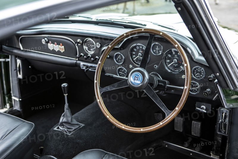Steering wheel and dashboard of a 1961 Aston Martin DB4 GT previously owned by Donald Campbell. Creator: Unknown.