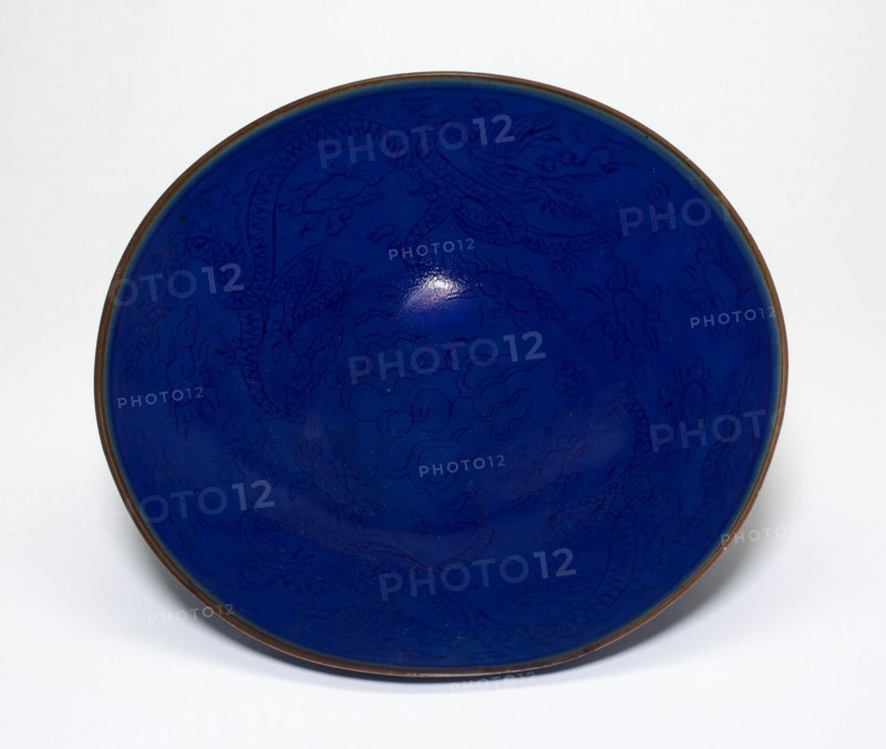 Low Bowl with Dragons amid Clouds Chasing Flaming Pearls, Ming dynasty (1368-1644).