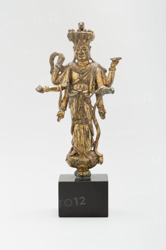 Eleven-Headed and Six-Armed Guanyin (Avalokiteshvara) Standing on a Lotus, Tang dynasty (618-907), c. 9th century.