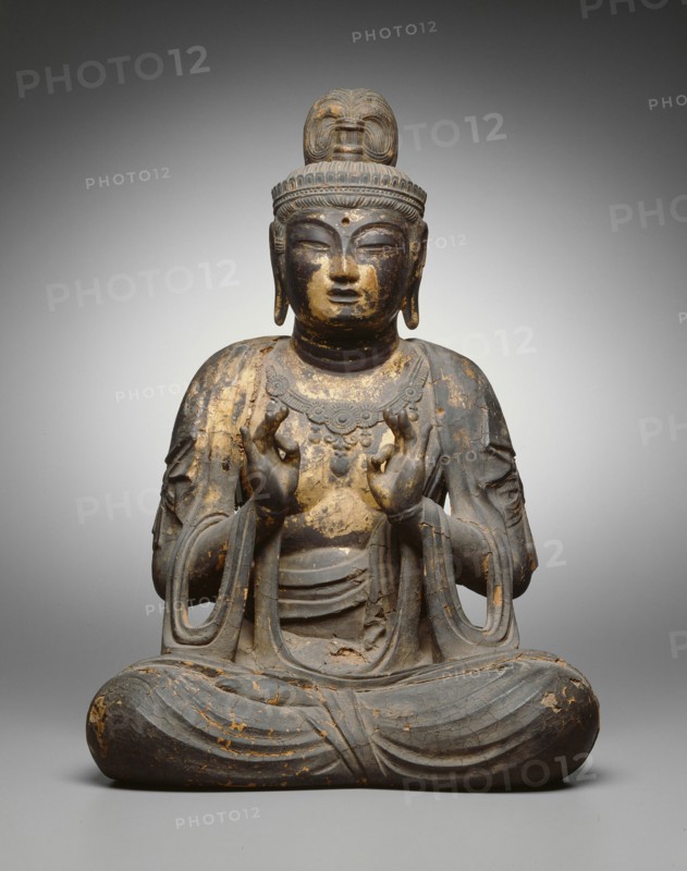 Seated Bodhisattva, 8th century. Seated wooden Buddha statue with with forefinger touching thumb.