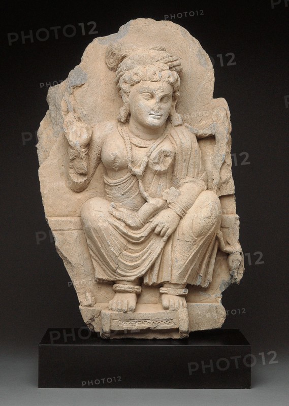 Goddess Hariti Seated Holding a Child, 2nd/3rd century. Ancient region of Gandhara (modern Pakistan).
