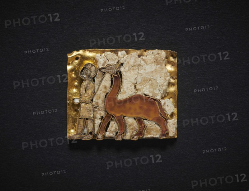 Votive plaque in cloisonné with man leading a camel. From the Oxus Temple..., 6th-5th cent. BC. Creator: Central Asian Art.