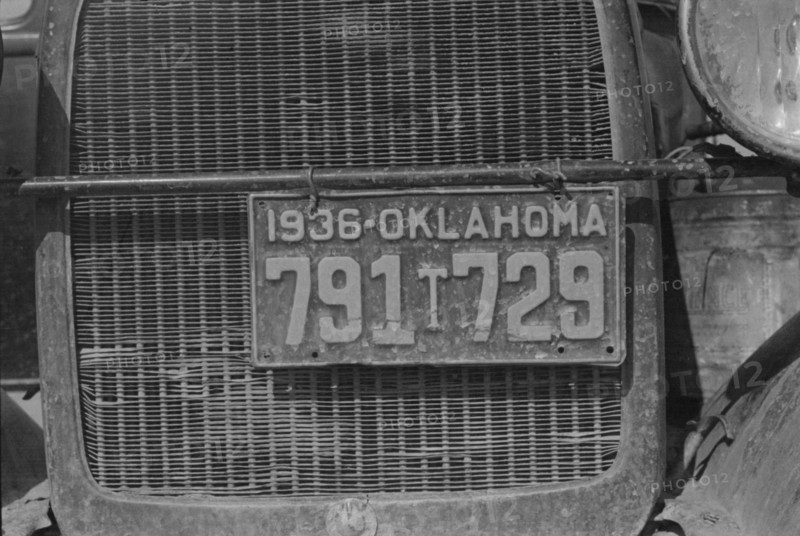 Radiator and license of Oklahoma cotton picker's car, San Joaquin Valley, California, 1936. Creator: Dorothea Lange.