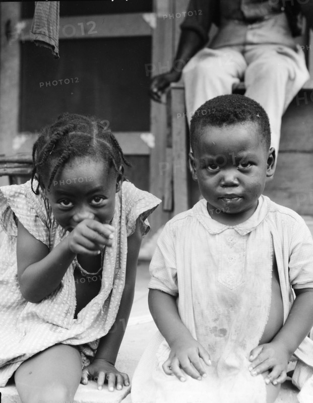 Children of evicted sharecropper, now living on Sherwood Eddy cooperative plantation, 1936. Creator: Dorothea Lange.