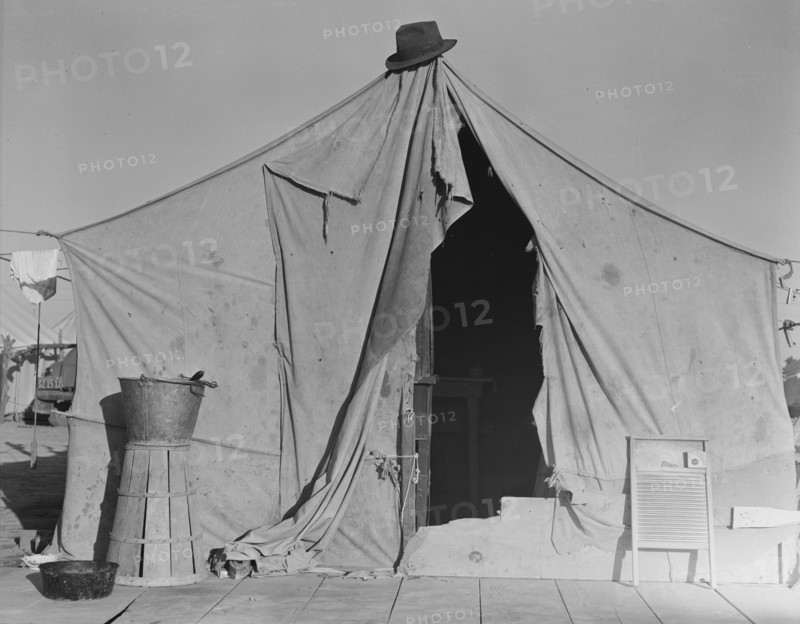 One of a row of tents, home of a pea picker, near Calipatria, Imperial Valley, CA, 1939. Creator: Dorothea Lange.
