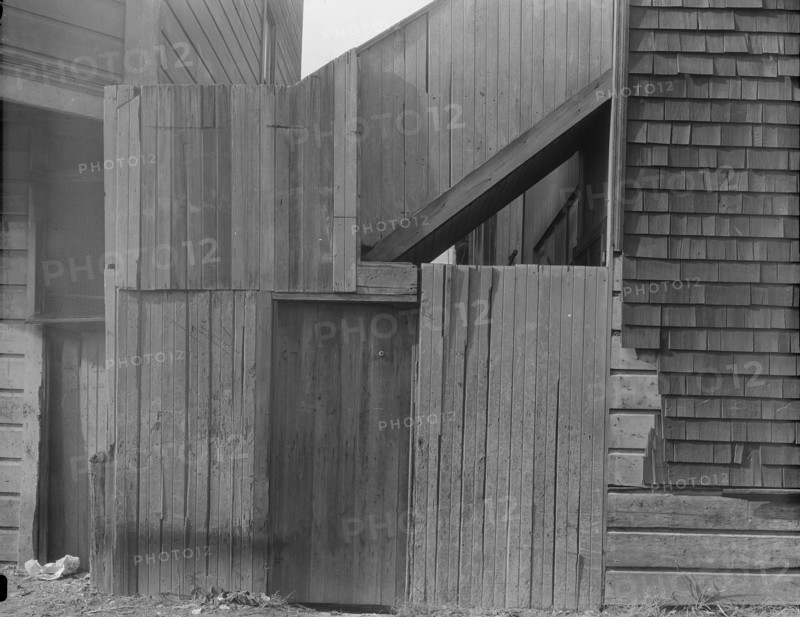 Mission District firetrap, San Francisco, California, 1936. Creator: Dorothea Lange.