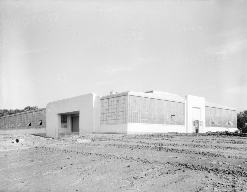 View of nearly completed factory for garment workers, Hightstown, New Jersey, 1936. Creator: Dorothea Lange.