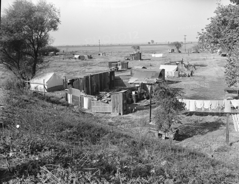 Migrant camp on the outskirts of Sacramento, California on the American River, 1936. Creator: Dorothea Lange.