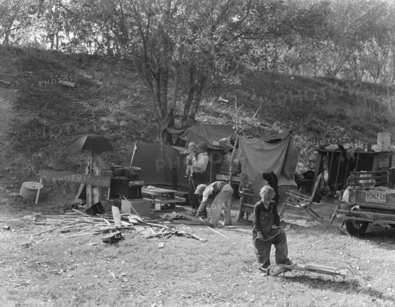 Destitute family, American River camp, near Sacramento, California., 1936. Creator: Dorothea Lange.