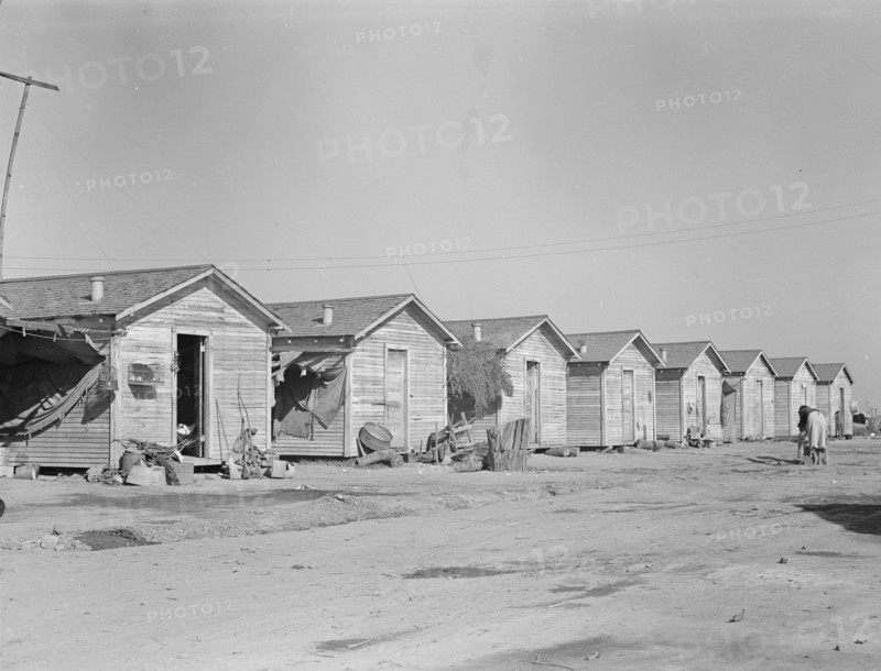 Company housing for cotton workers near Corcoran, California, 1936. Creator: Dorothea Lange.
