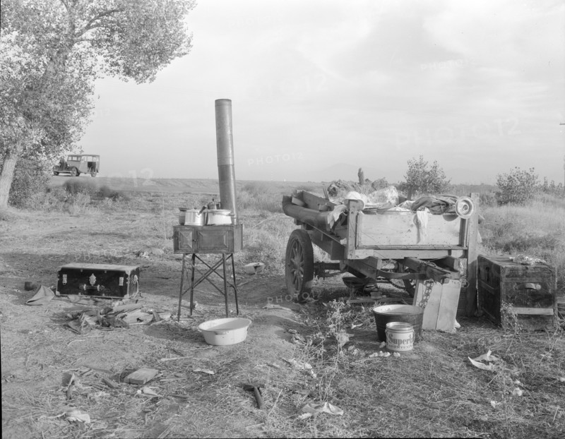 Migratory workers' "kitchen" near Shafter, Kern County, California, 1936. Creator: Dorothea Lange.