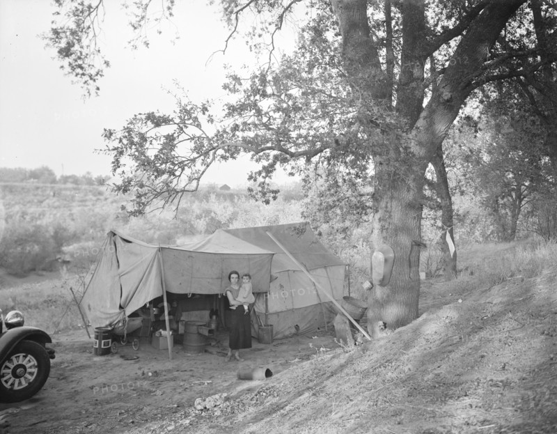 Wife and child of migrant worker, encamped near Winters, California, 1936. Creator: Dorothea Lange.