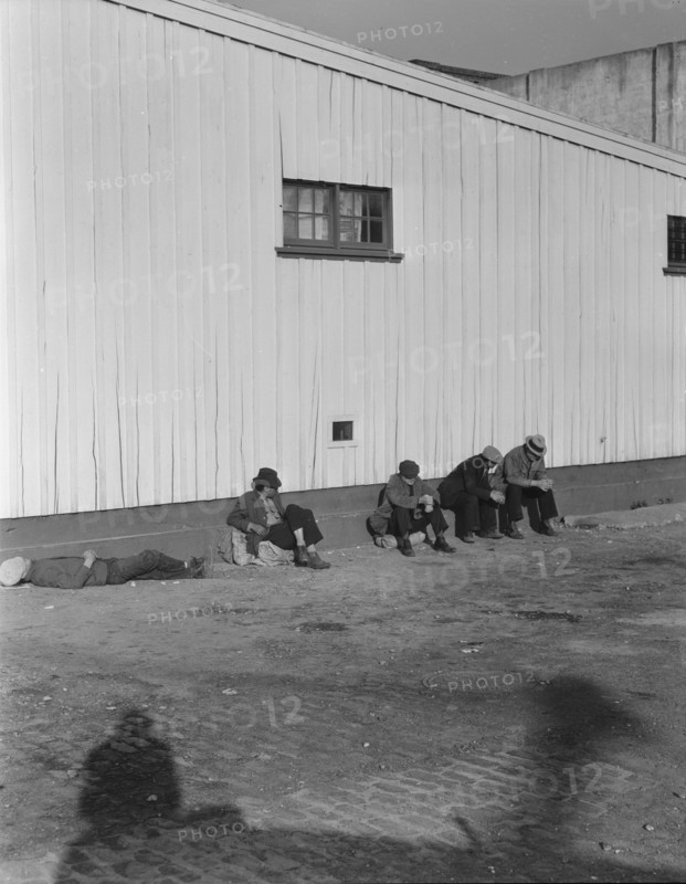 On the sun side of the shed, Transient men, San Francisco, California, 1936. Creator: Dorothea Lange.