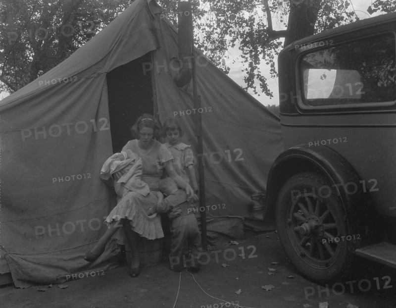 Mother and three children in a California squatter camp, 1936. Creator: Dorothea Lange.